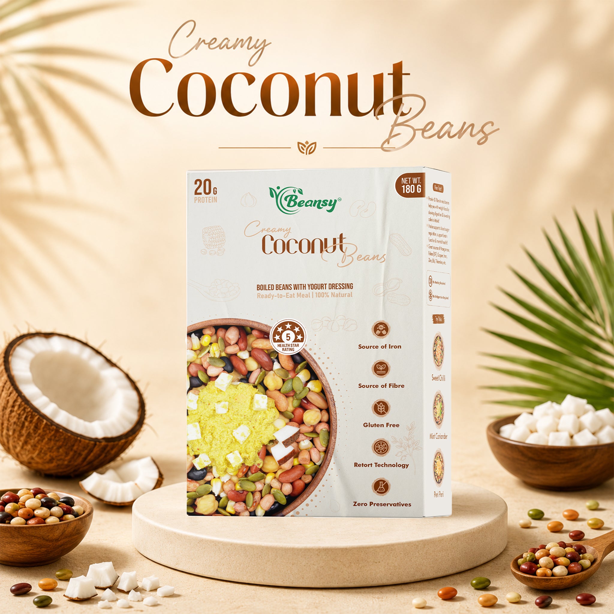 Box of 'Creamy Coconut Beans' with coconut and beans on a wooden surface